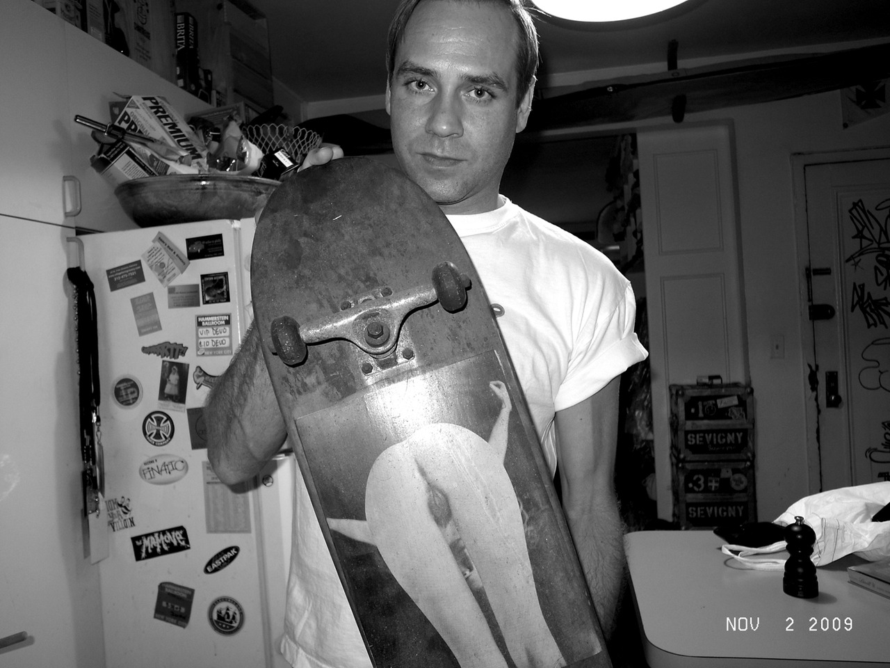 Paul Sevigny at his apartment with the first skateboard customized by